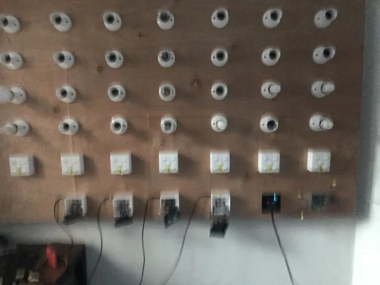 Large panel containing rows of circular and rectangular device assemblies.
